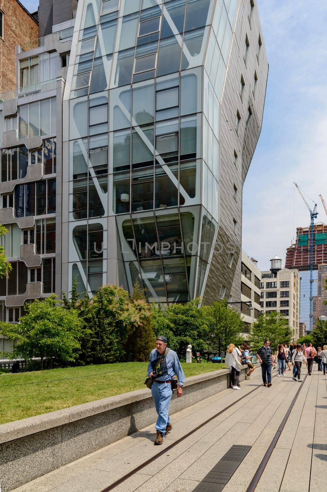 New York, NY, USA - June 8, 2015: The High Line Park in New York City, USA. It is a 2,33 km long elevated linear park, greenway and rail trail, created on a former New York Central Railroad spur on the west side of Manhattan.