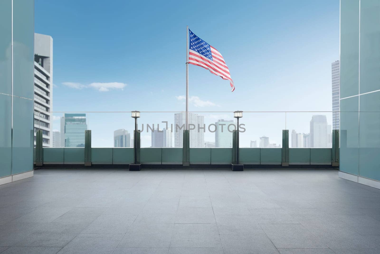 Flag of United States of America waving on terrace building. Independence day 4th of July