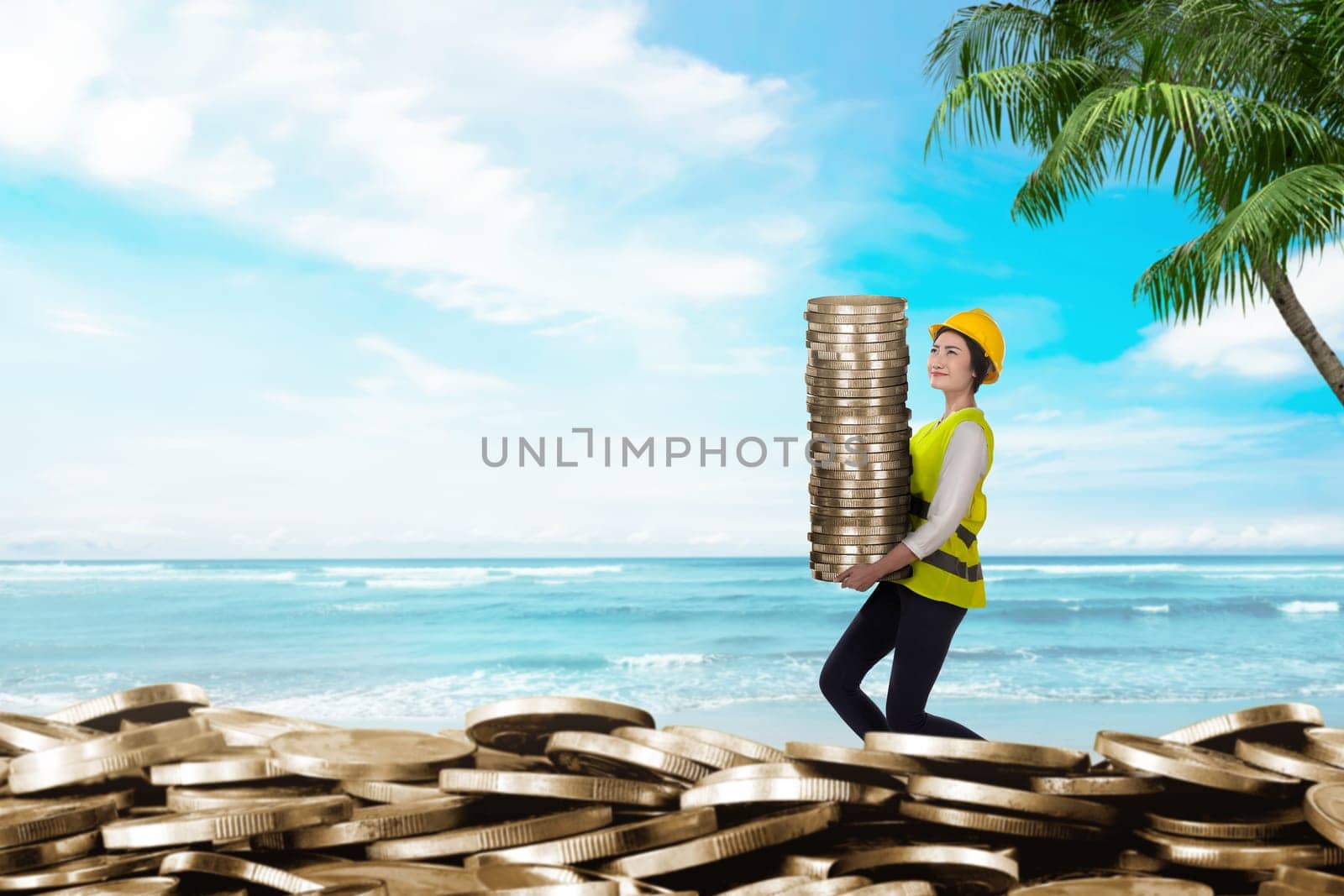 Pretty asian workers bringing coin stacks. Summer saving concept