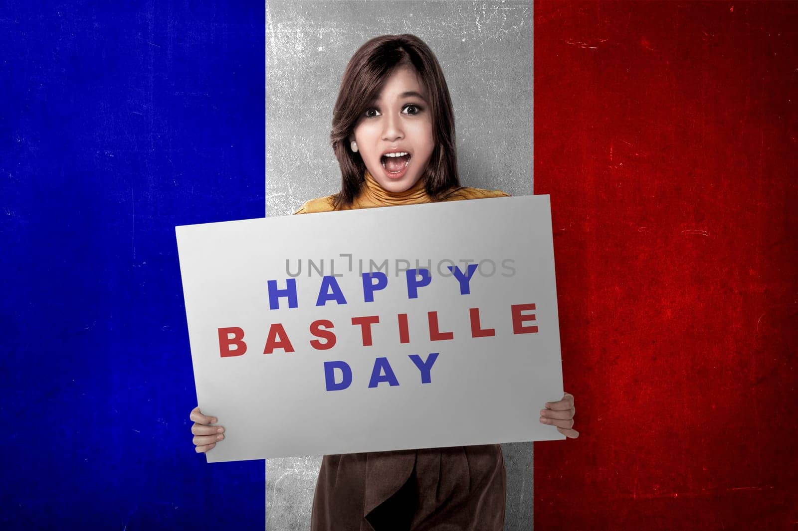 Attractive asian woman with board with Bastille day message. Happy Bastille Day