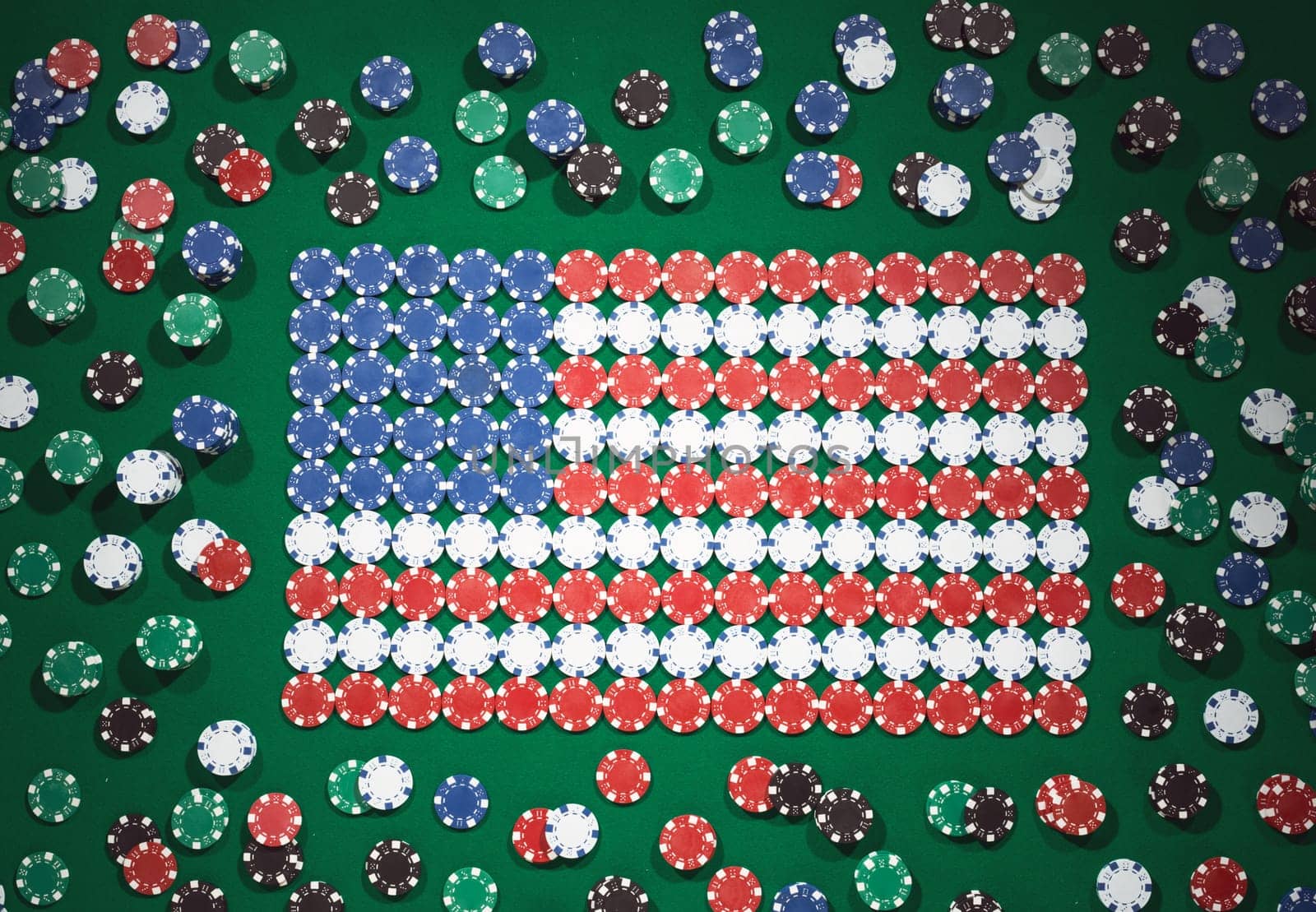 American flag composed of chips on a green table top view, casino and gambling concept