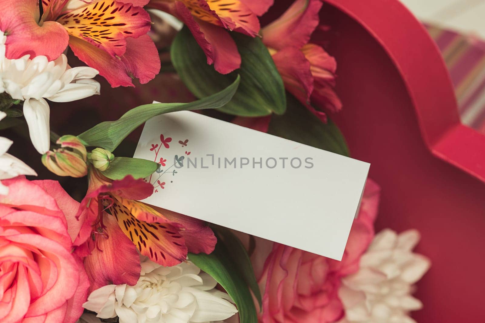 Love background with pink roses, flowers, gift, card on table. Concept of holiday Mother's Day. Copy space. Colorful studio background. holiday congratulations concept. Mother and love. Postcard
