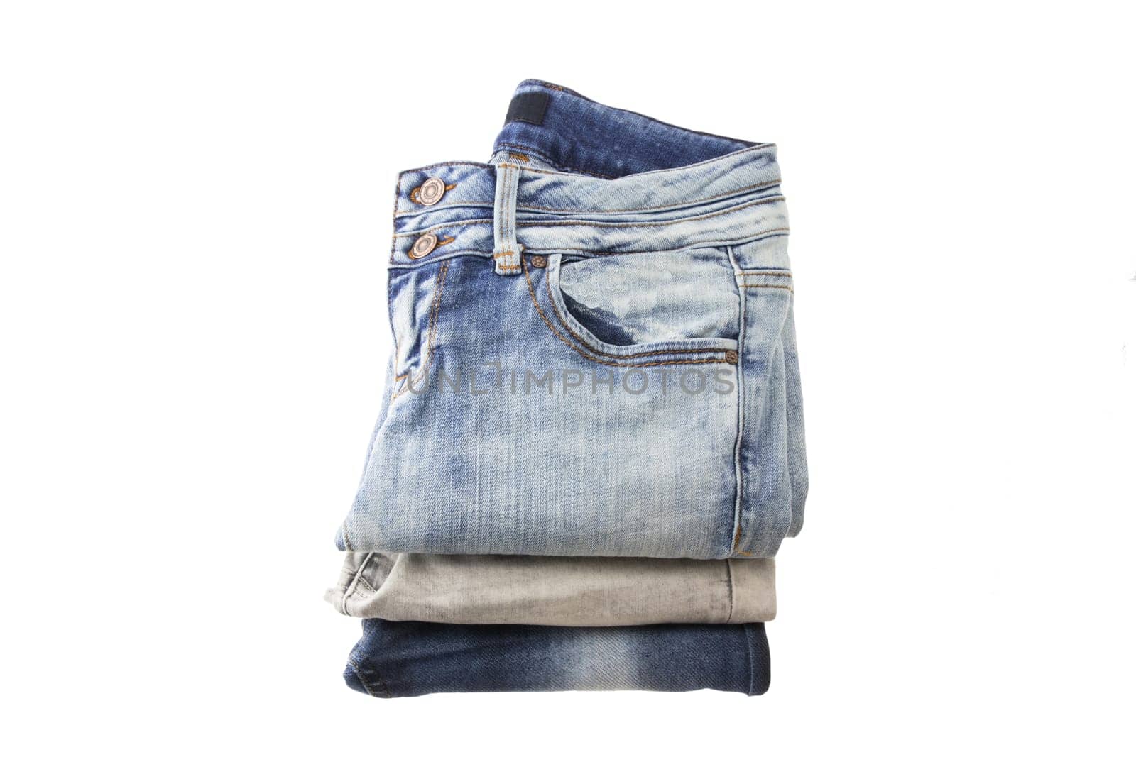 stack of jeans for women on a white backround