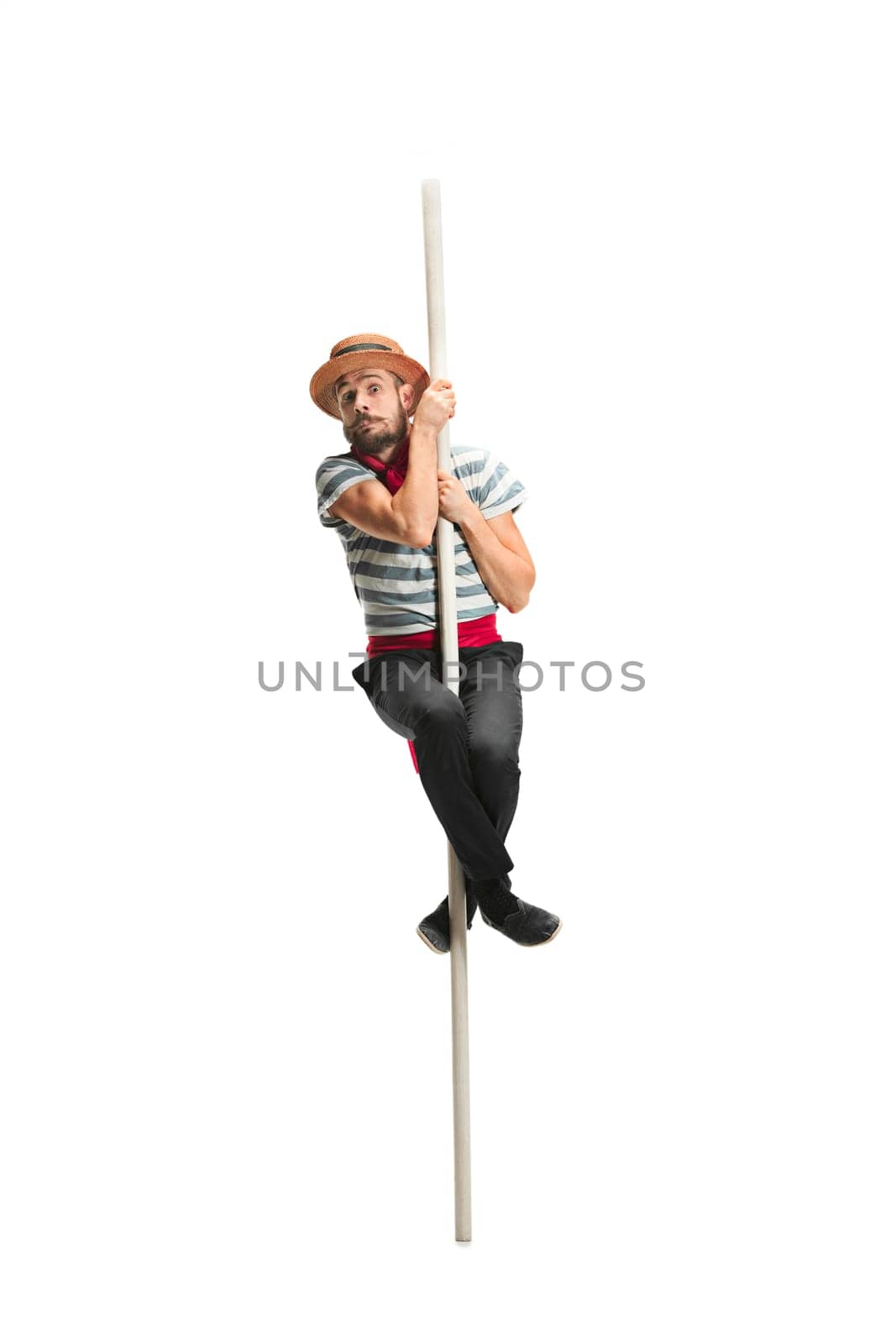 Caucasian funny bearded man in traditional gondolier costume and hat hanging on paddle at studio isolated on white background. discouraged young man. Human emotions, facial expression concept