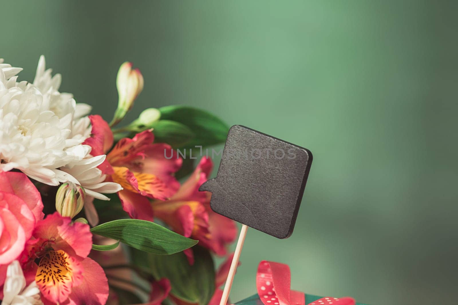 Love background with pink roses, flowers, gift, card. Concept of holiday Mother's Day. Copy space. Colorful studio background. holiday congratulations concept. Mother and love. Postcard