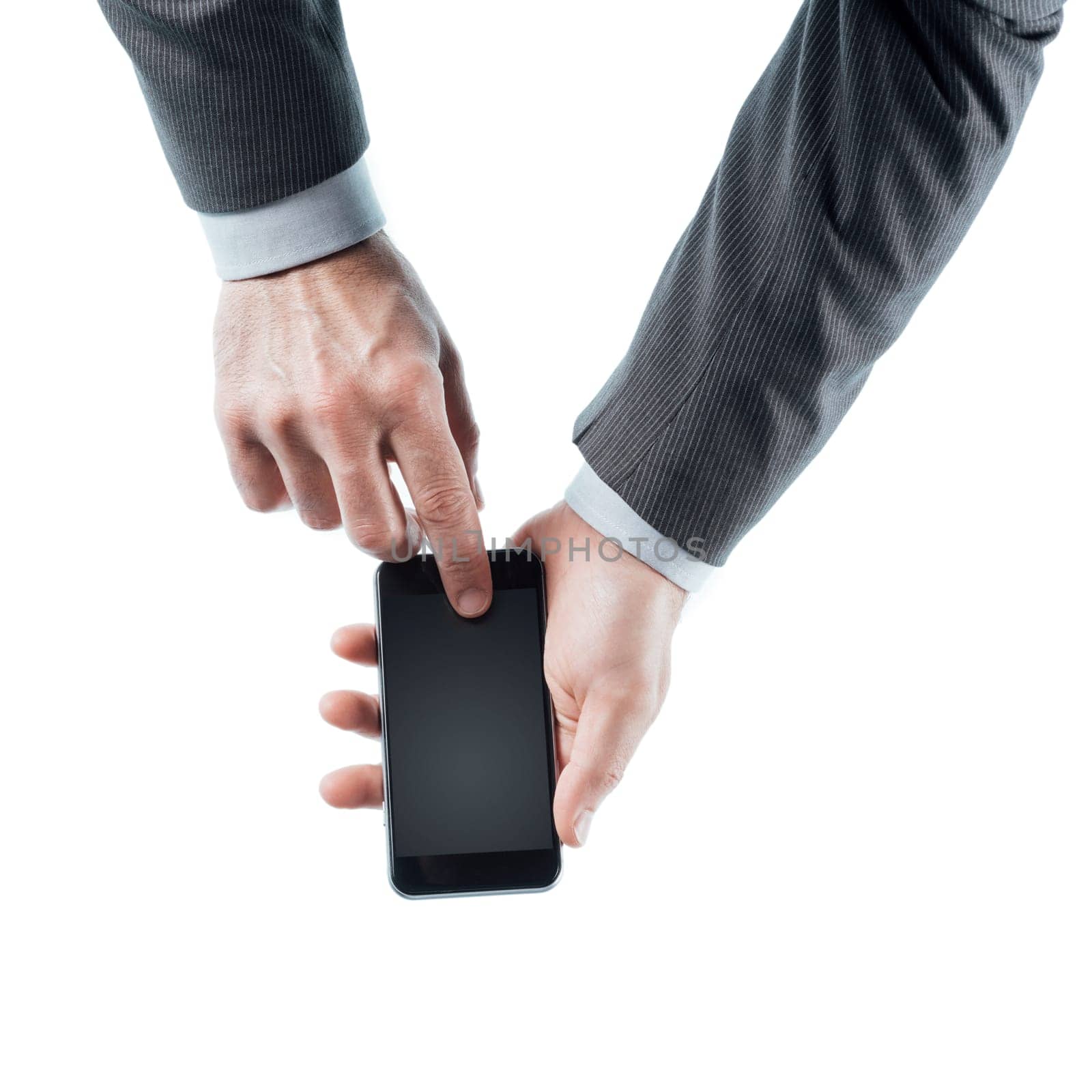 Businessman holding a touch screen smart phone and pressing a button on white background, hands close up, unrecognizable person