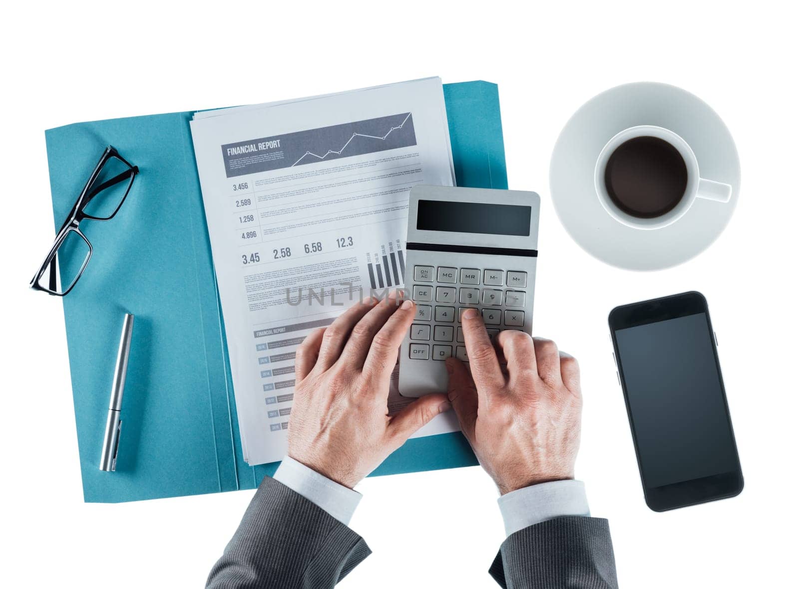 Professional businessman at desk checking a financial report and using a calculator