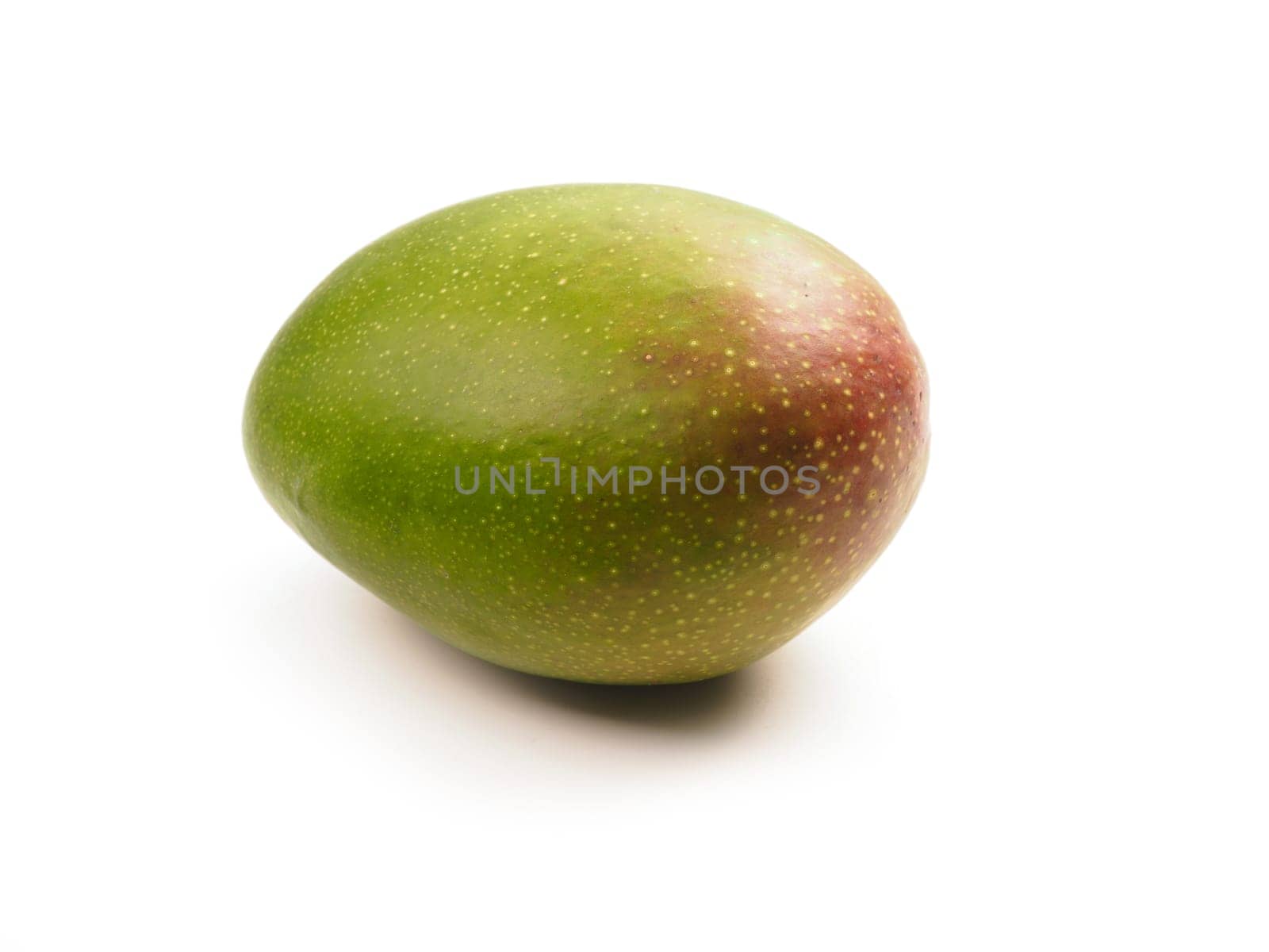 Fresh organic mango fruit on a white background, healthy eating