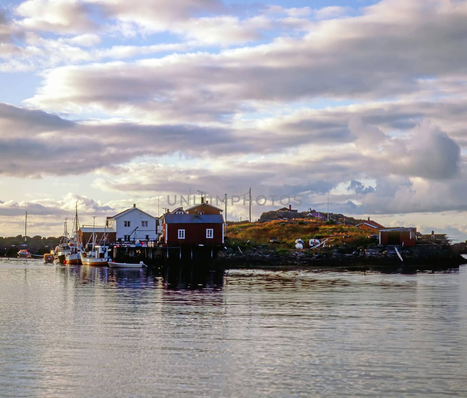 Lofoten with boats in harbor and clouds,  Norway