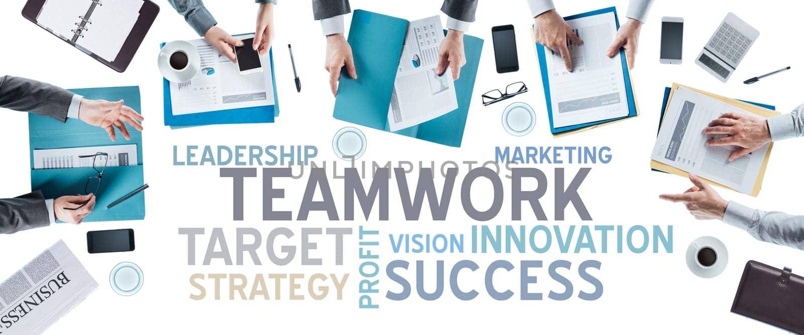 Business text concepts and business team working at office desk during a meeting, hands top view, unrecognizable people, strategy and teamwork concept