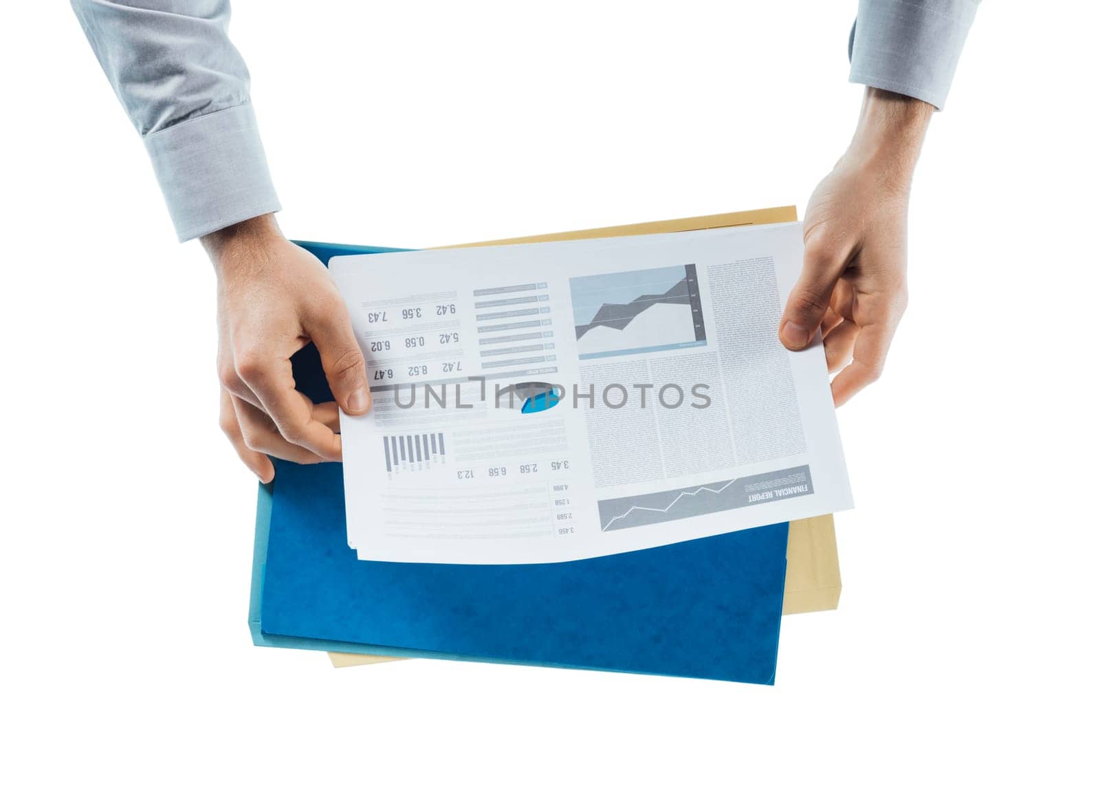 Businessman reading a financial report with charts and graphs on white background, hands close up, top view