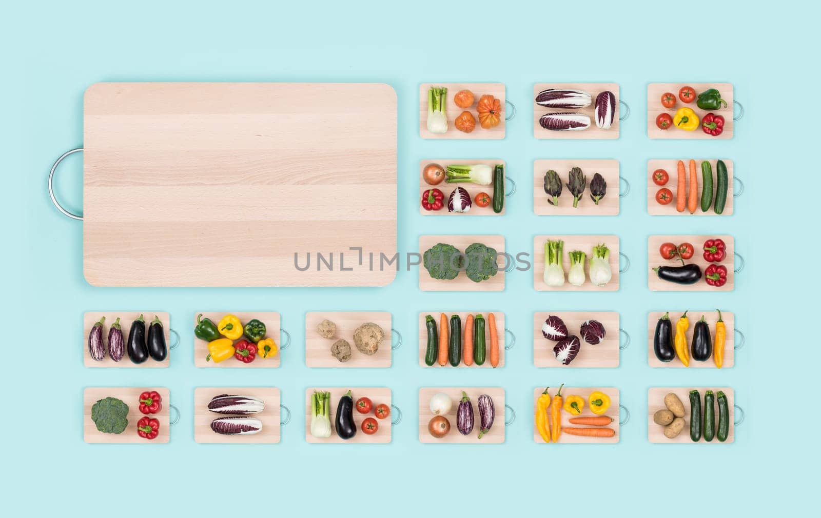 Fresh organic vegetables assortment on wooden chopping boards and copy space: healthy eating and vegan food concept