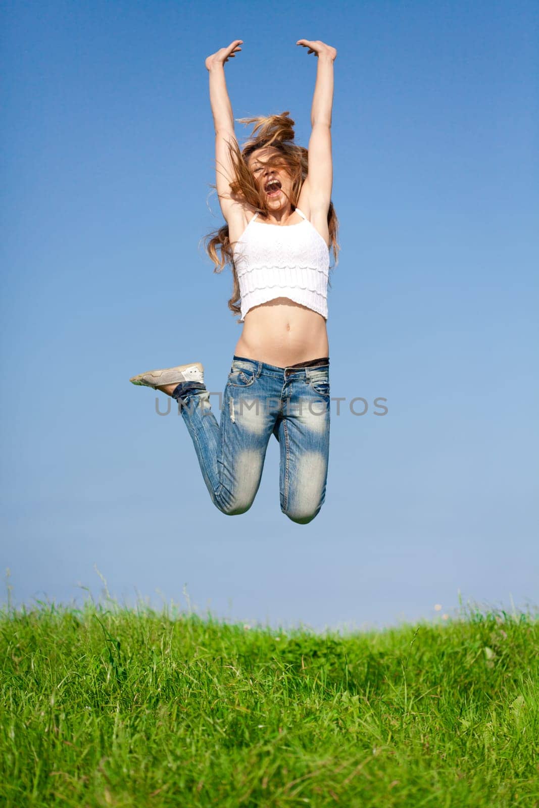Happy girl on summer meadow