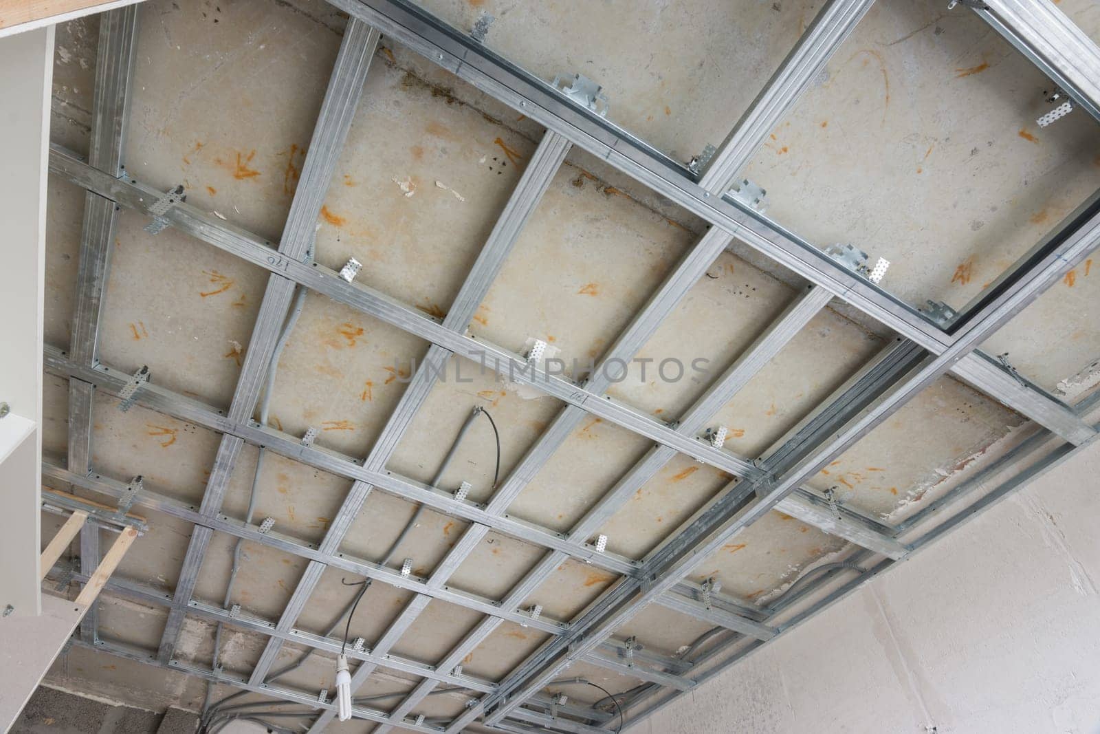 Skeleton of a ceiling from a metal profile, for the subsequent drywall sheets