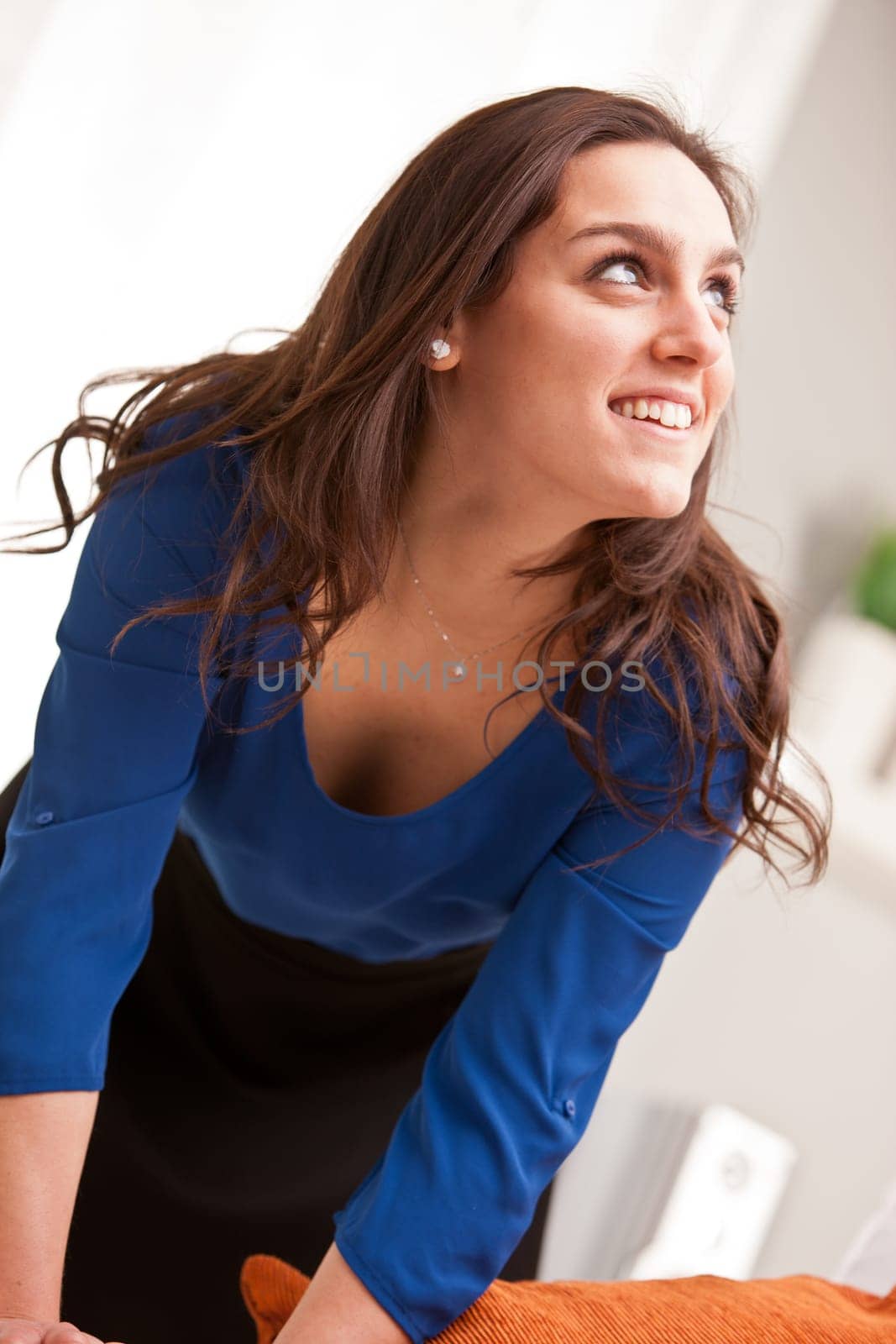blue and black dressed girl with a jewel looking upright into her possibilities