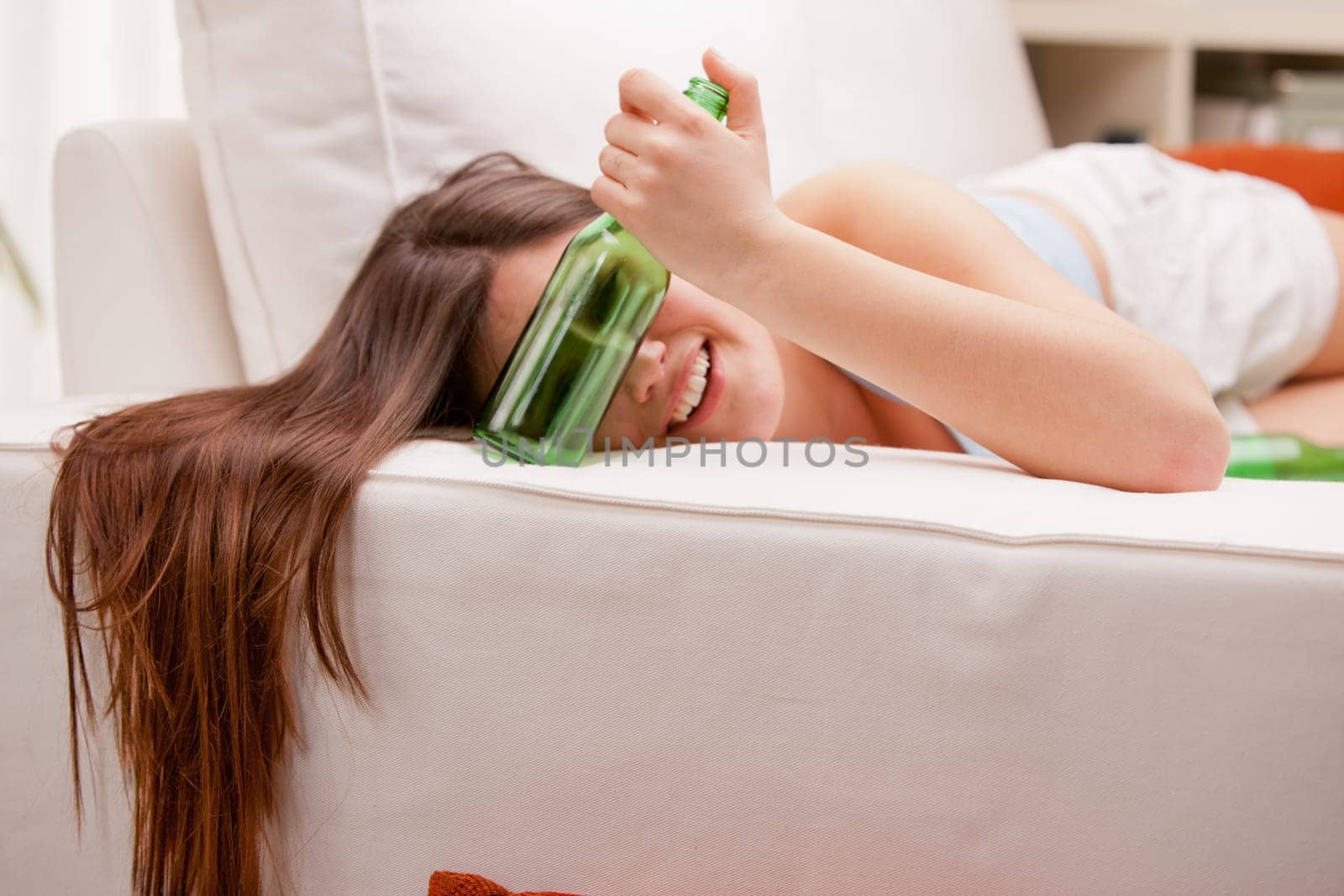 drunk girl on her sofa in her living room
