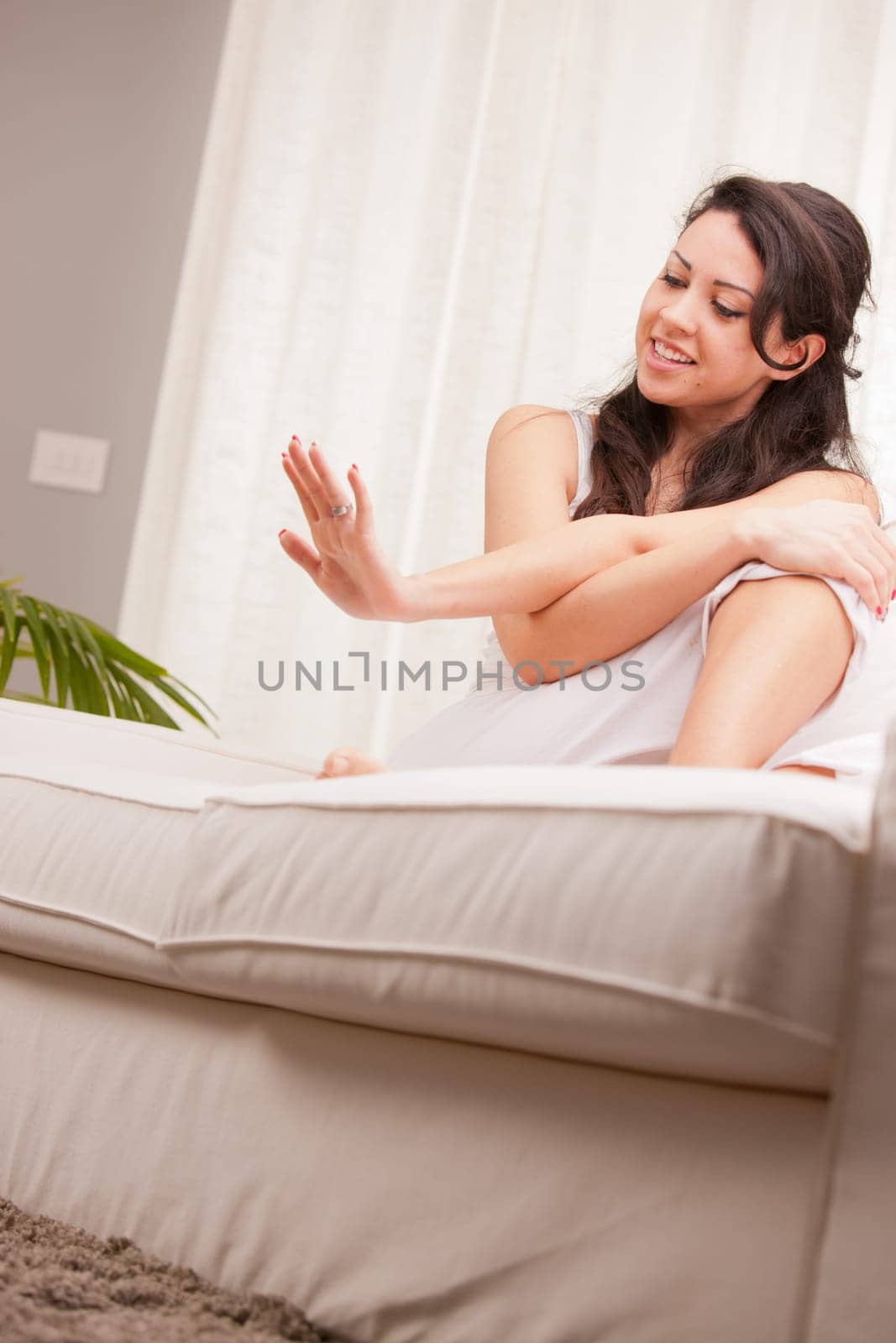 girl watching her nails and thinking she's going to make some art
