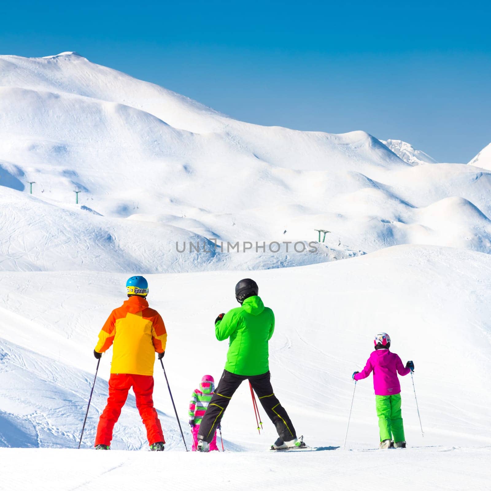 Family on winter ski vacations in ski slopes in Alps, Vogel, Slovenia, Europe.
