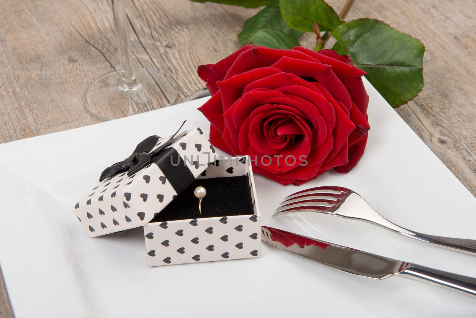 valentine day gift on a plate with red rose