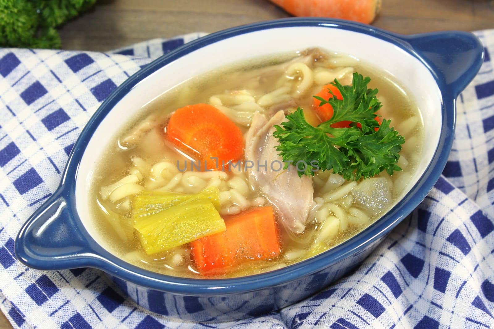 Letter soup with soup vegetables and chicken meat