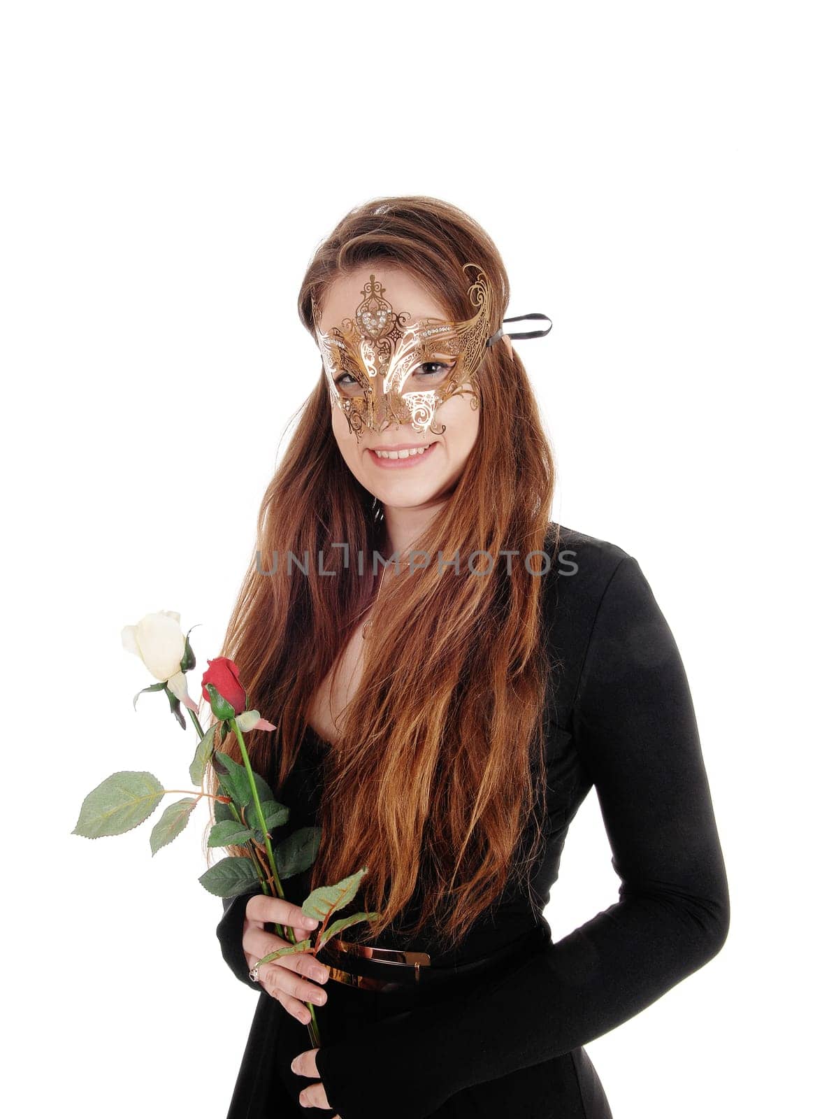 A close up image of a beautiful woman in a black dress and a gold.mask over her face holding roses in hand, isolated for white background.