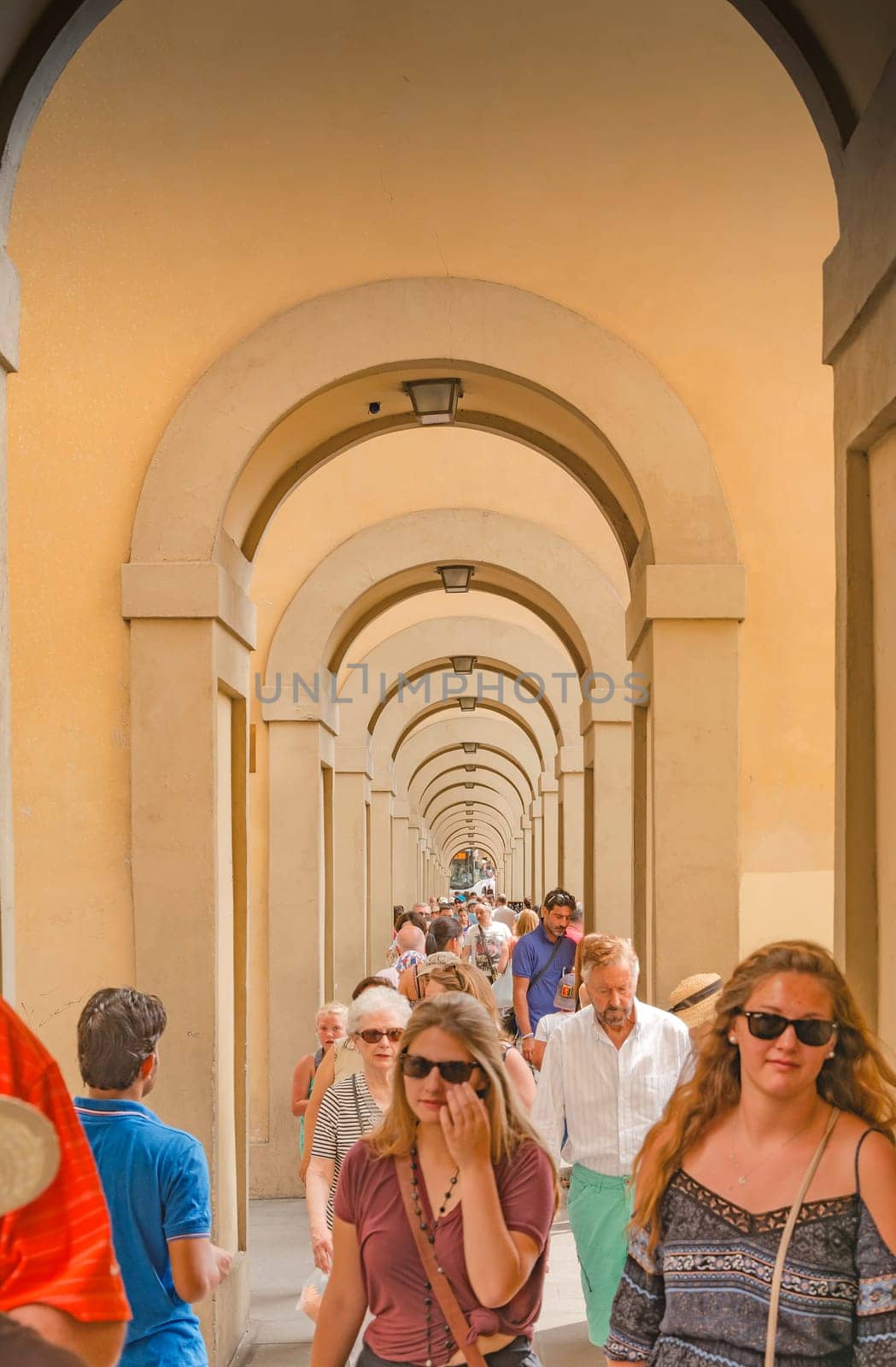 Florence, Italy, June 2015: a large number of tourists flock to the famous Vasari Corridor near the Uffizi museum in Florence