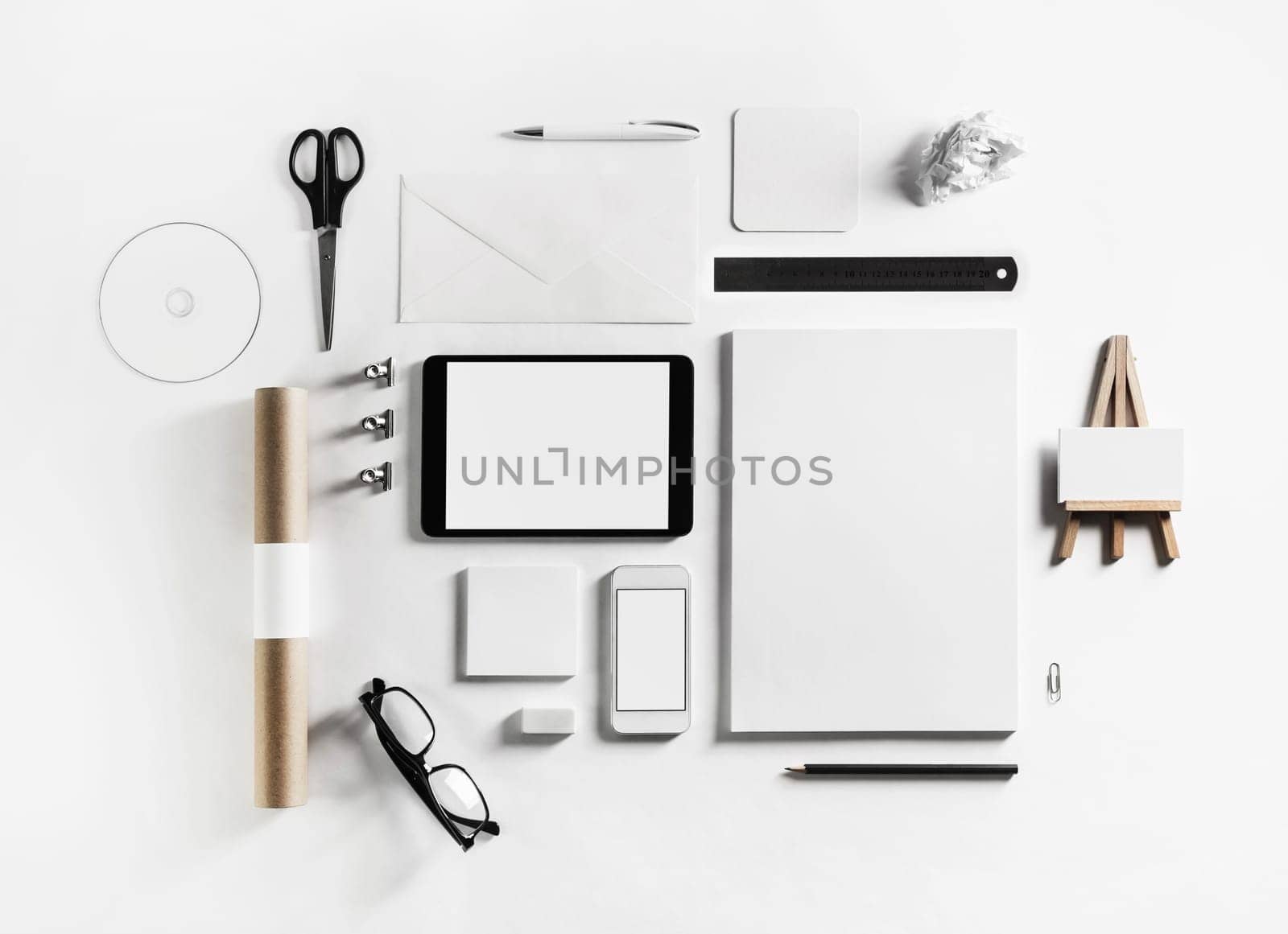 Blank corporate stationery and gadgets set on white paper background. Top view. Flat lay.