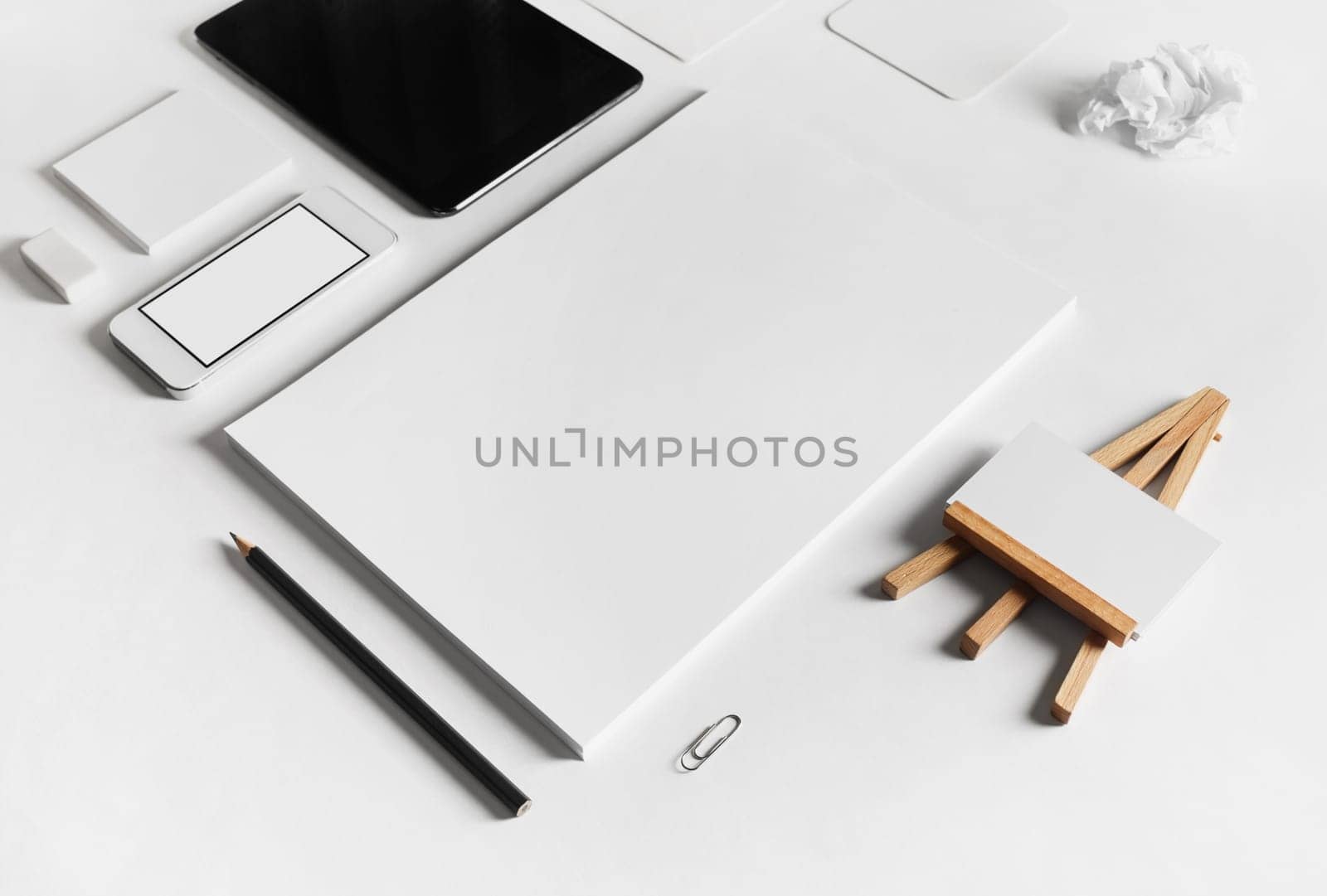 Blank stationery set on white paper background. Selective focus.