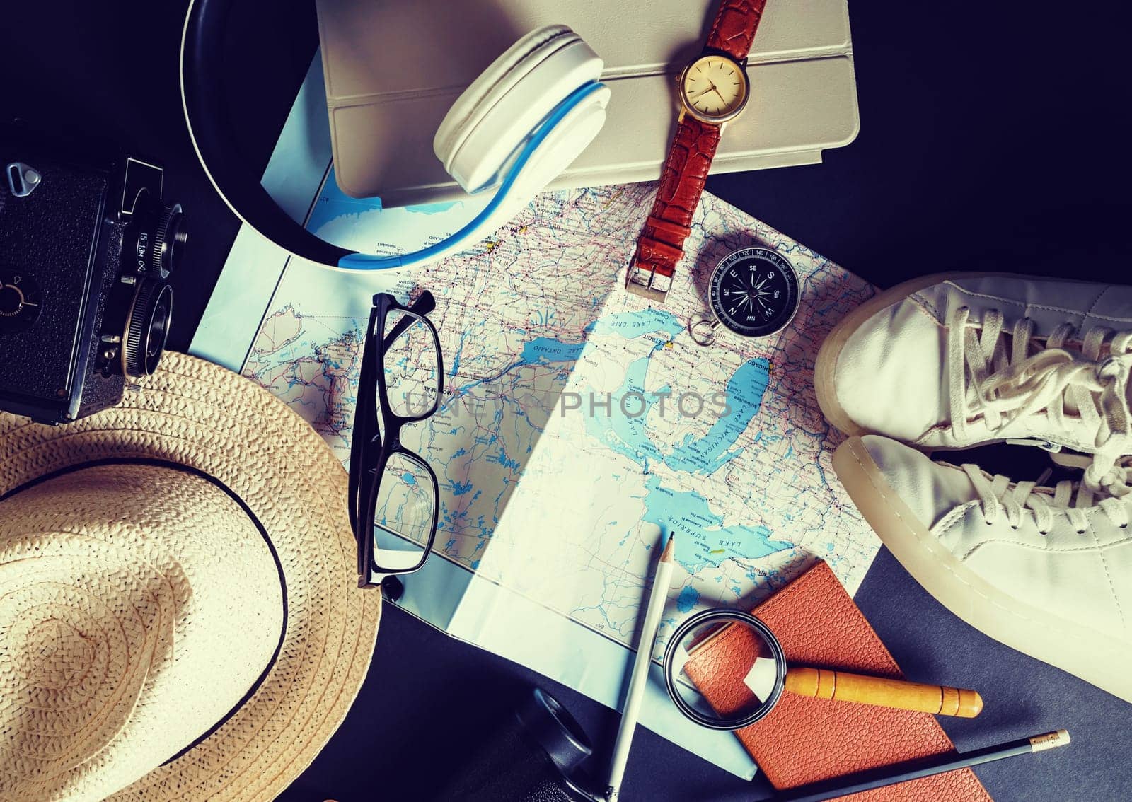 Accessories for travel. Traveler's outfit and vacation items. Vintage toned image. Top view. Flat lay.