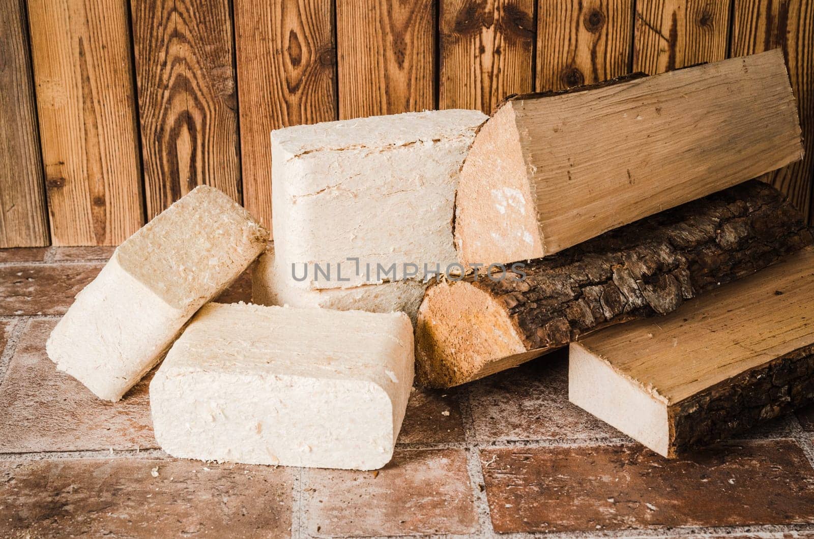 Wood briquette and firewood, close-up