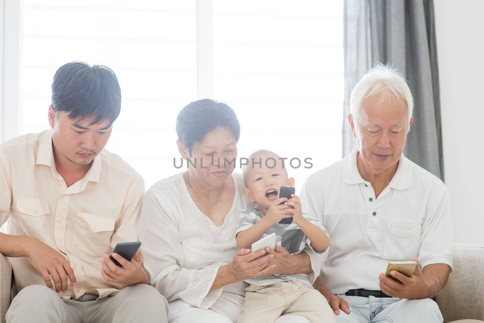 Technology devices, gadgets addicted family. Member family busy with their smart phone, communication problem.