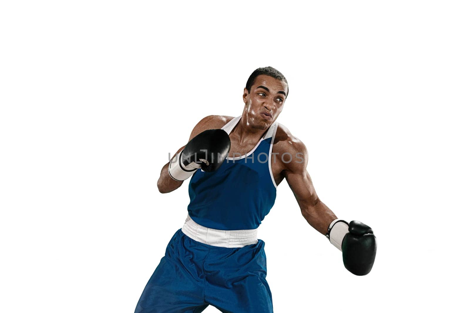 Sporty man during boxing exercises making hit. Photo of boxer on white background. Strength, attack and motion concept. Fit african american model in movement. Afro muscular athlete in sport uniform