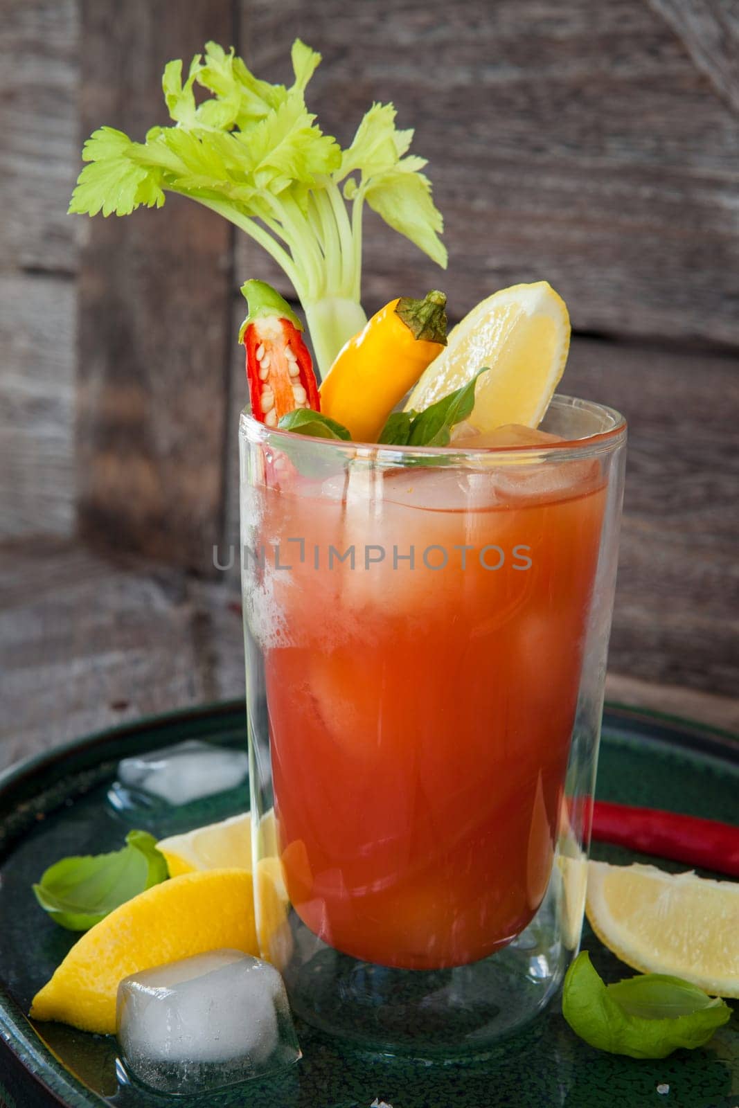 Colourful cocktail with tomato juice,garnished with vegetables