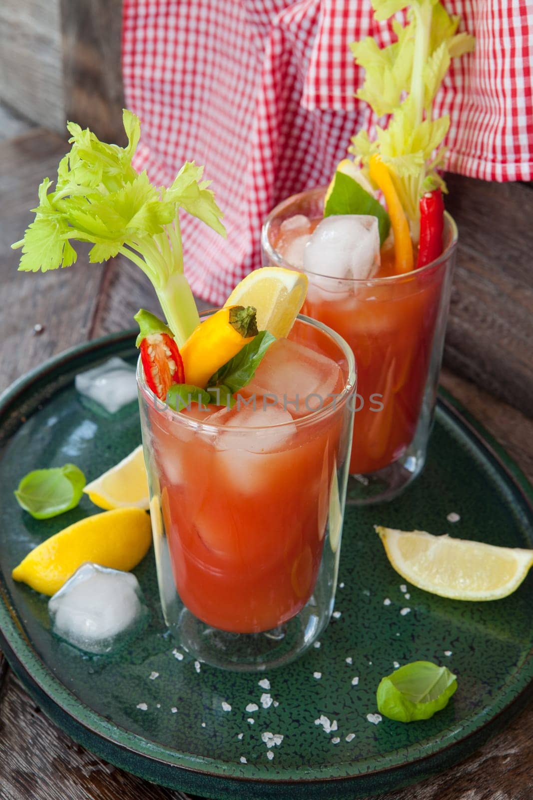 Colourful cocktail with tomato juice,garnished with vegetables