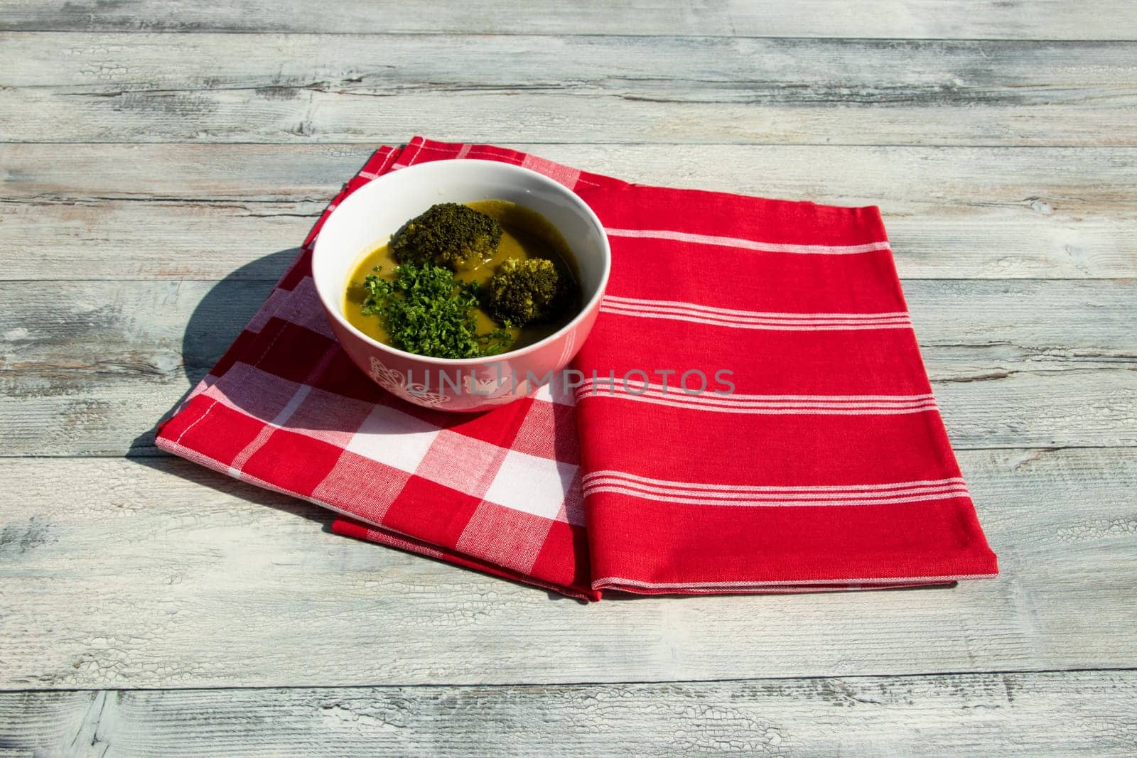 Healthy broccoli soup homemade with parsley. Health concept. Top view outdoor.
