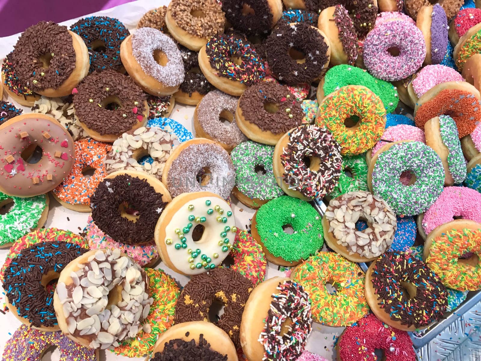 Set of assorted tasty donuts of different colors