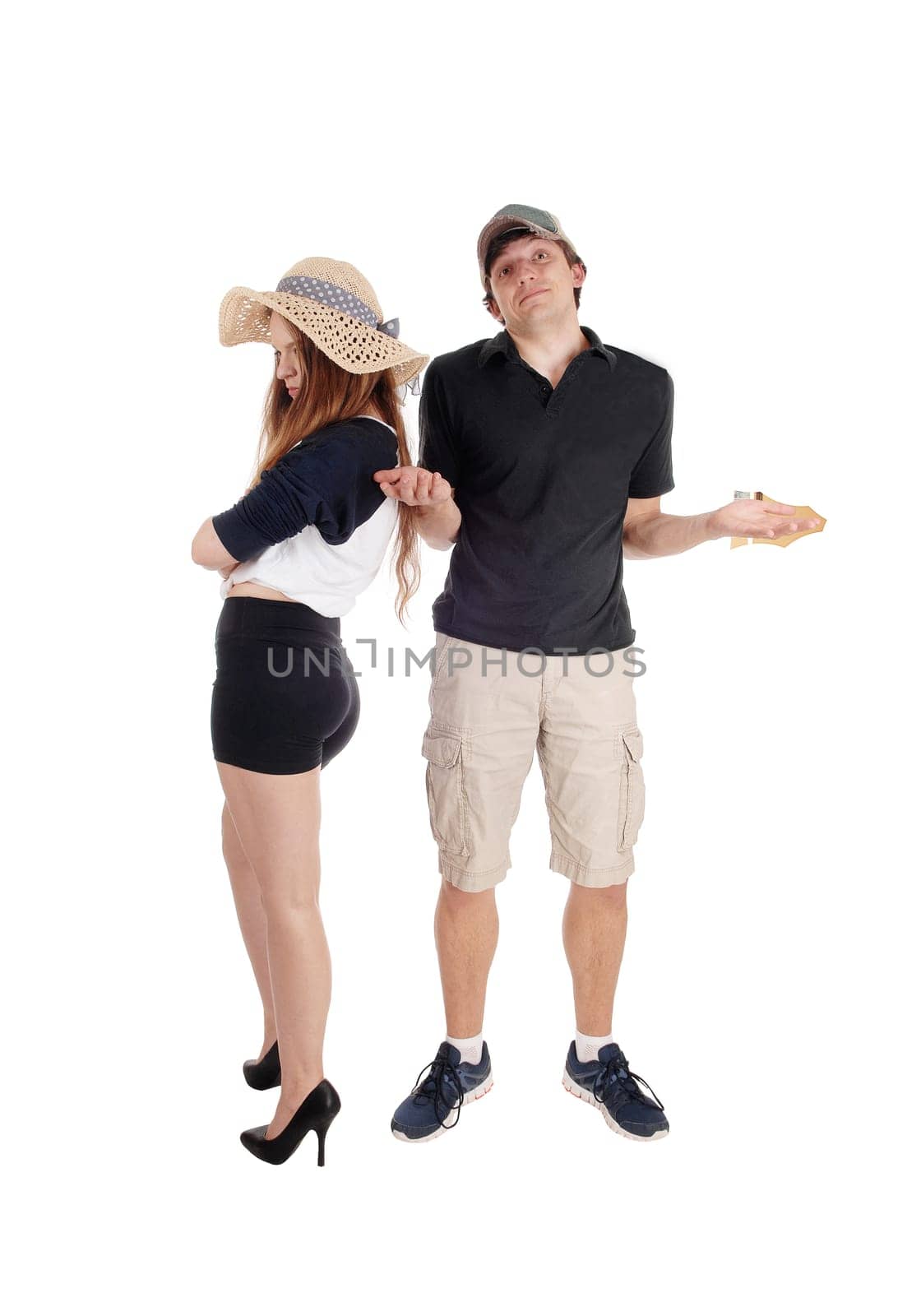An upset young couple standing isolated for white background turning.there back and are helpless about the situation.