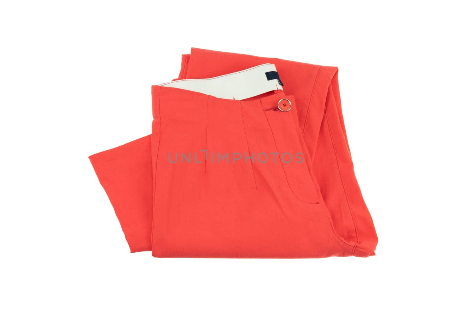 Red elegant woman trousers. Fashion concept. Isolated on white. Folded.