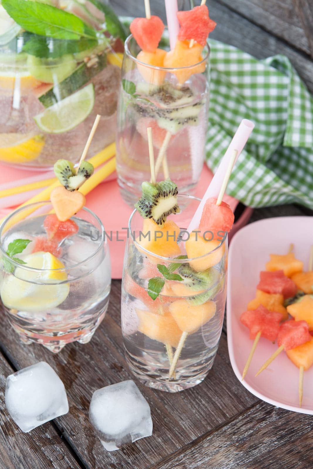 Fresh drinks with fresh fruit on skewers