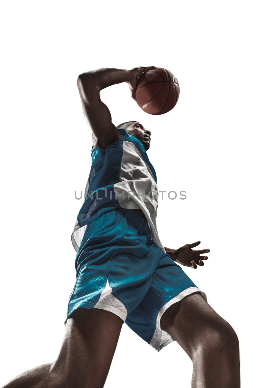 The portrait of a basketball player with a ball isolated on white studio background. advertising concept