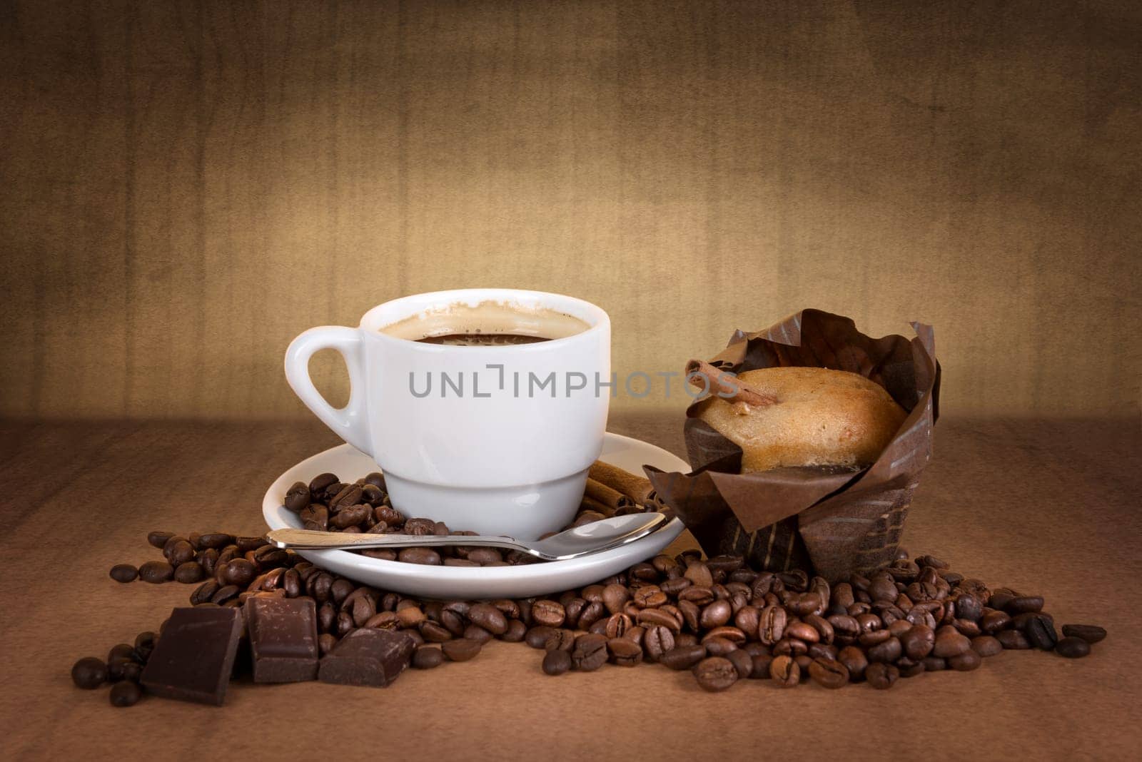 coffee cup with coffee beans, chocolate and muffin