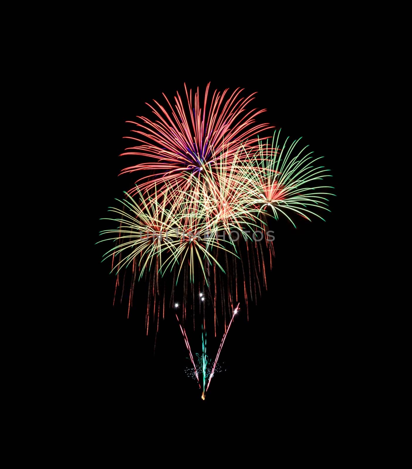 Green and red fireworks isolated on black background