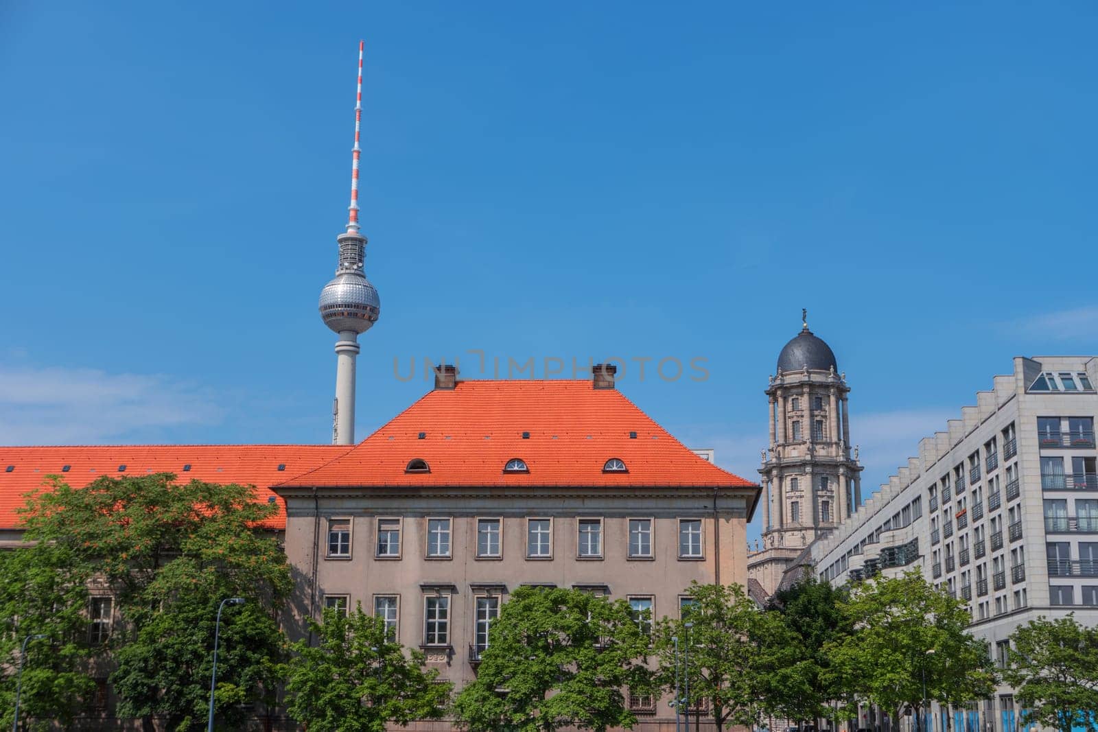 Berlin city, Germany, Europe. Cityscape with TV Tower. View of Berlin skyline in sunny summer day. City center with Television Tower, near Alexanderplatz. Popular landmark, famous travel destination