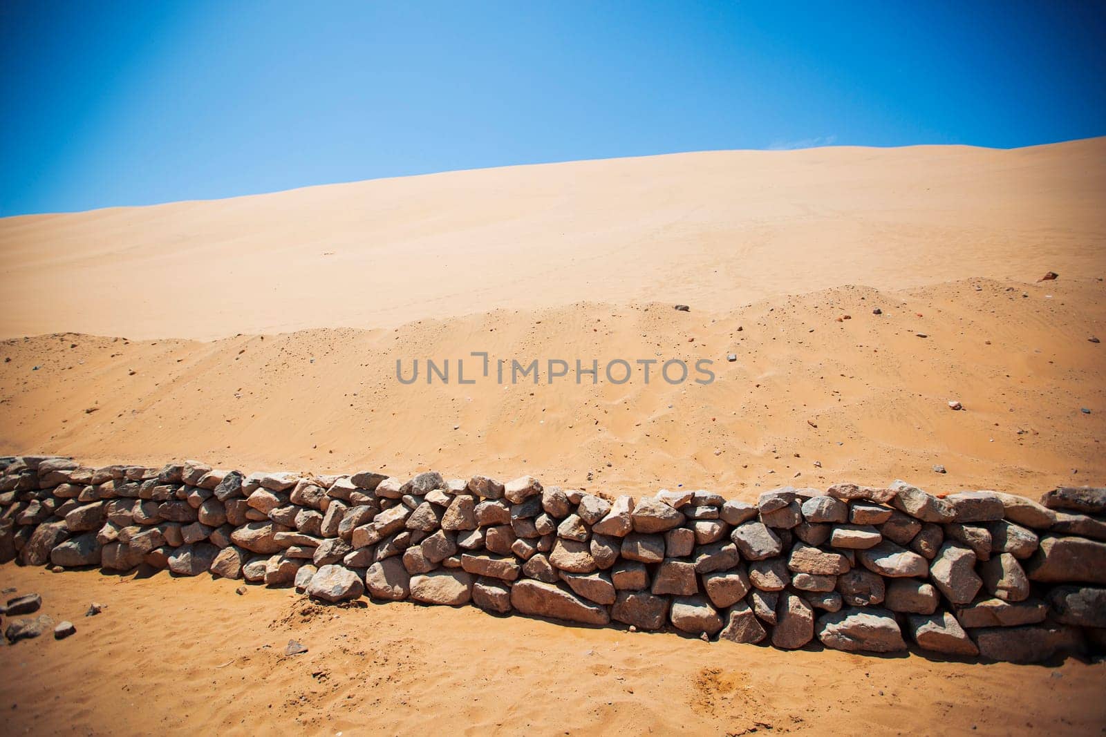 Sands dunes in the desert and blue sky.