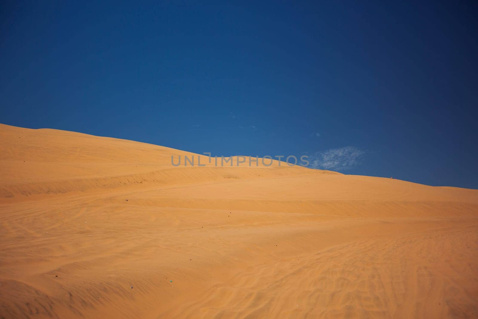 Sands dunes in the desert and blue sky.