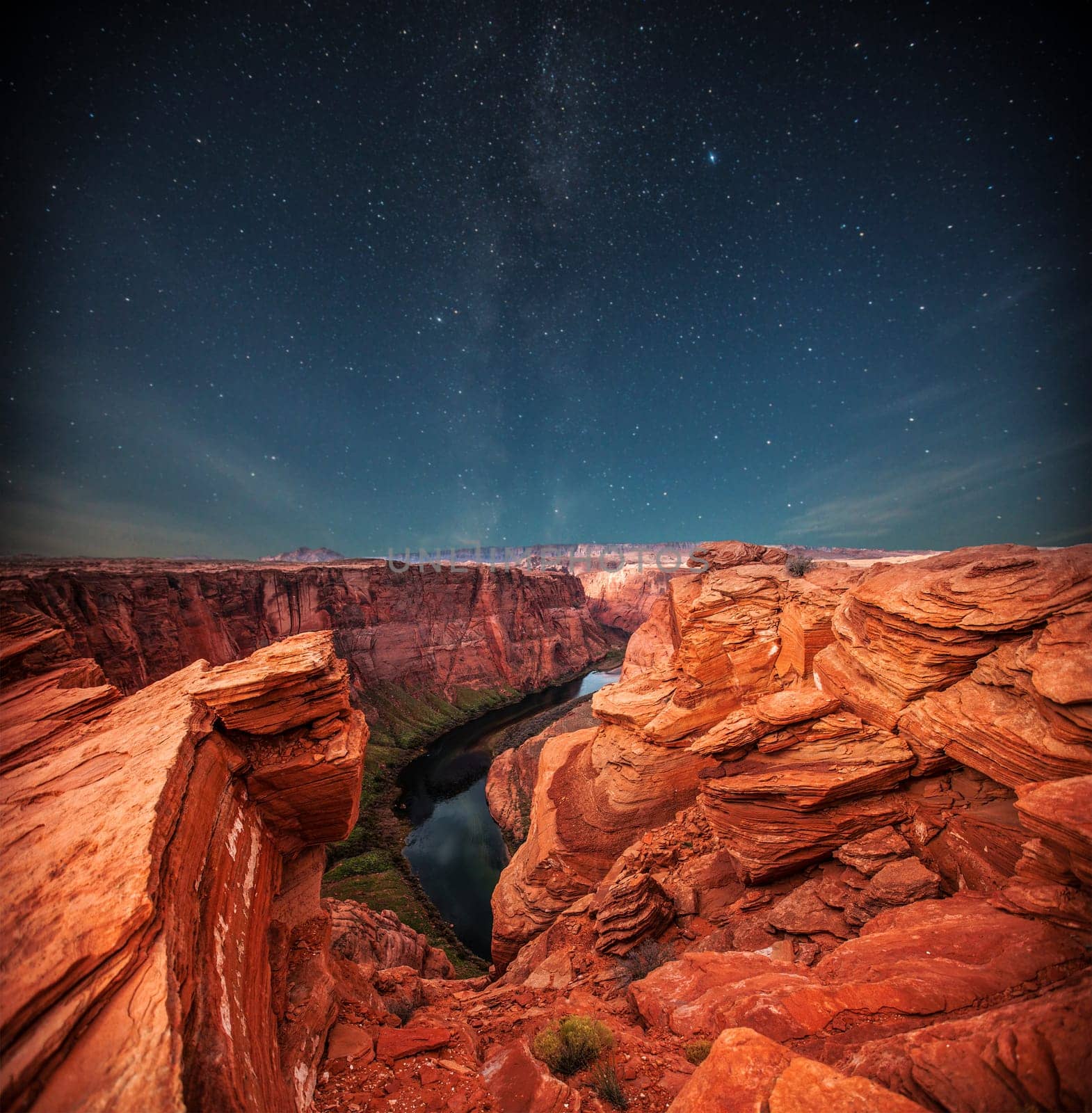 Grand Canyon at night under the light of the stars in the sky