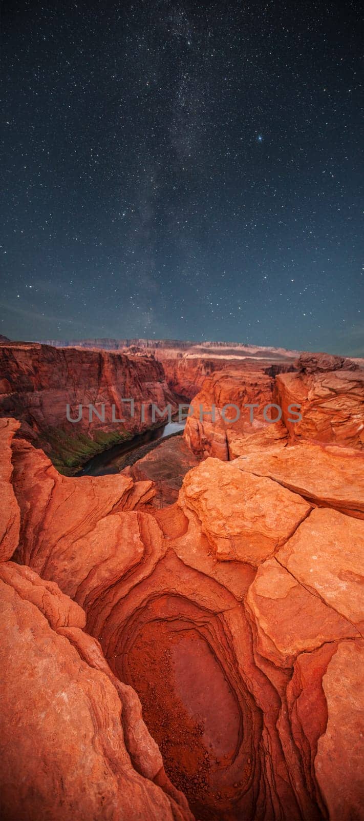Grand Canyon at night under the light of the stars in the sky