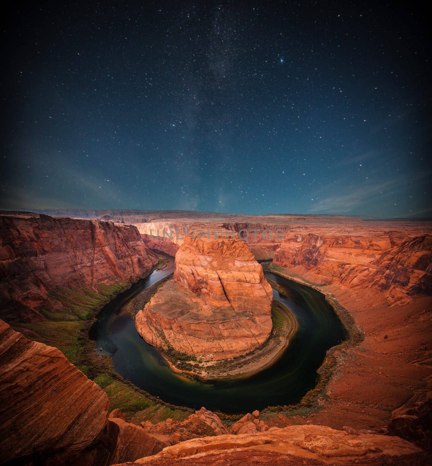 Grand Canyon at night under the light of the stars in the sky