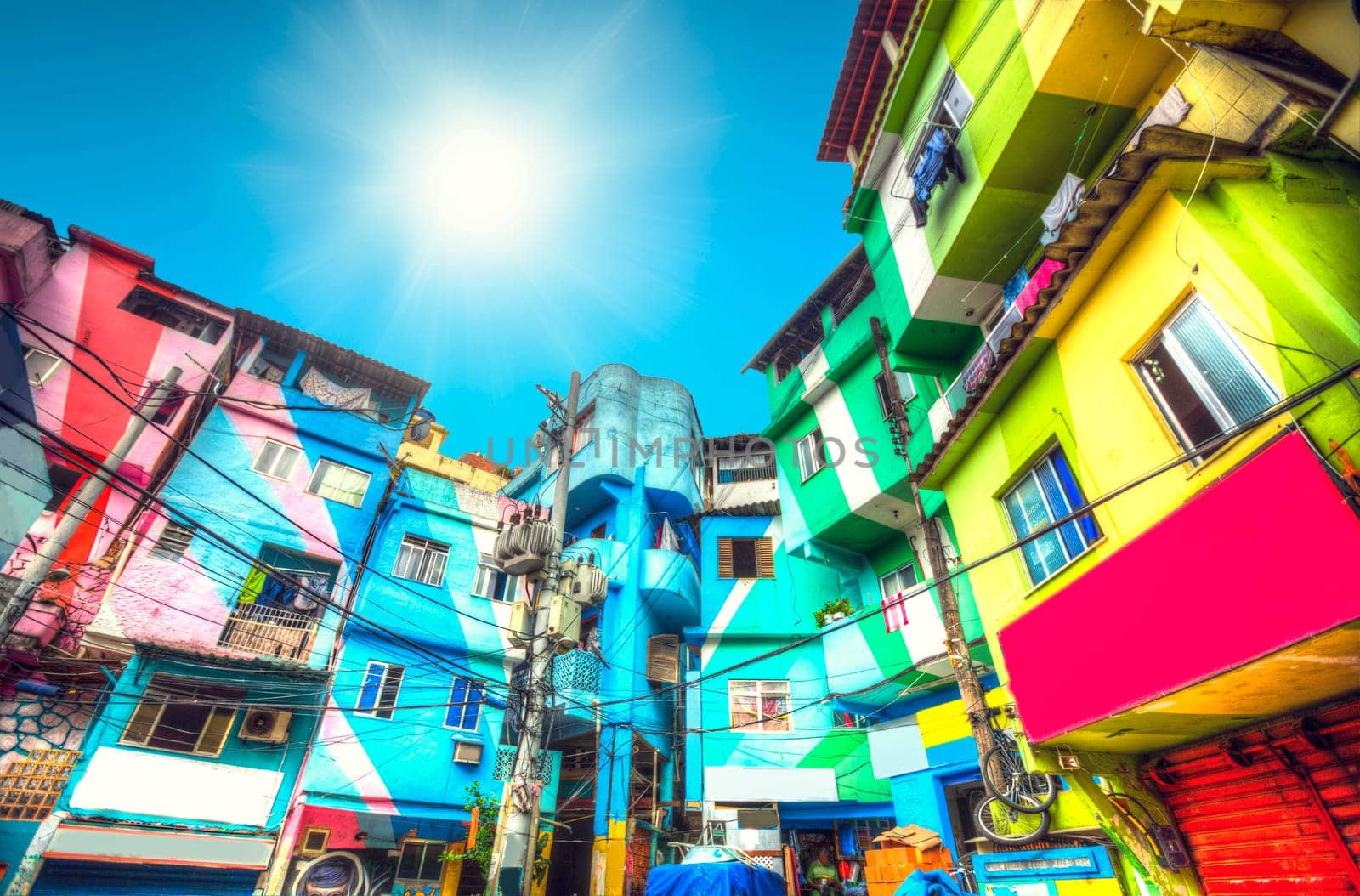 the sun is shining. Colorful painted buildings of Favela  in Rio de Janeiro Brazil