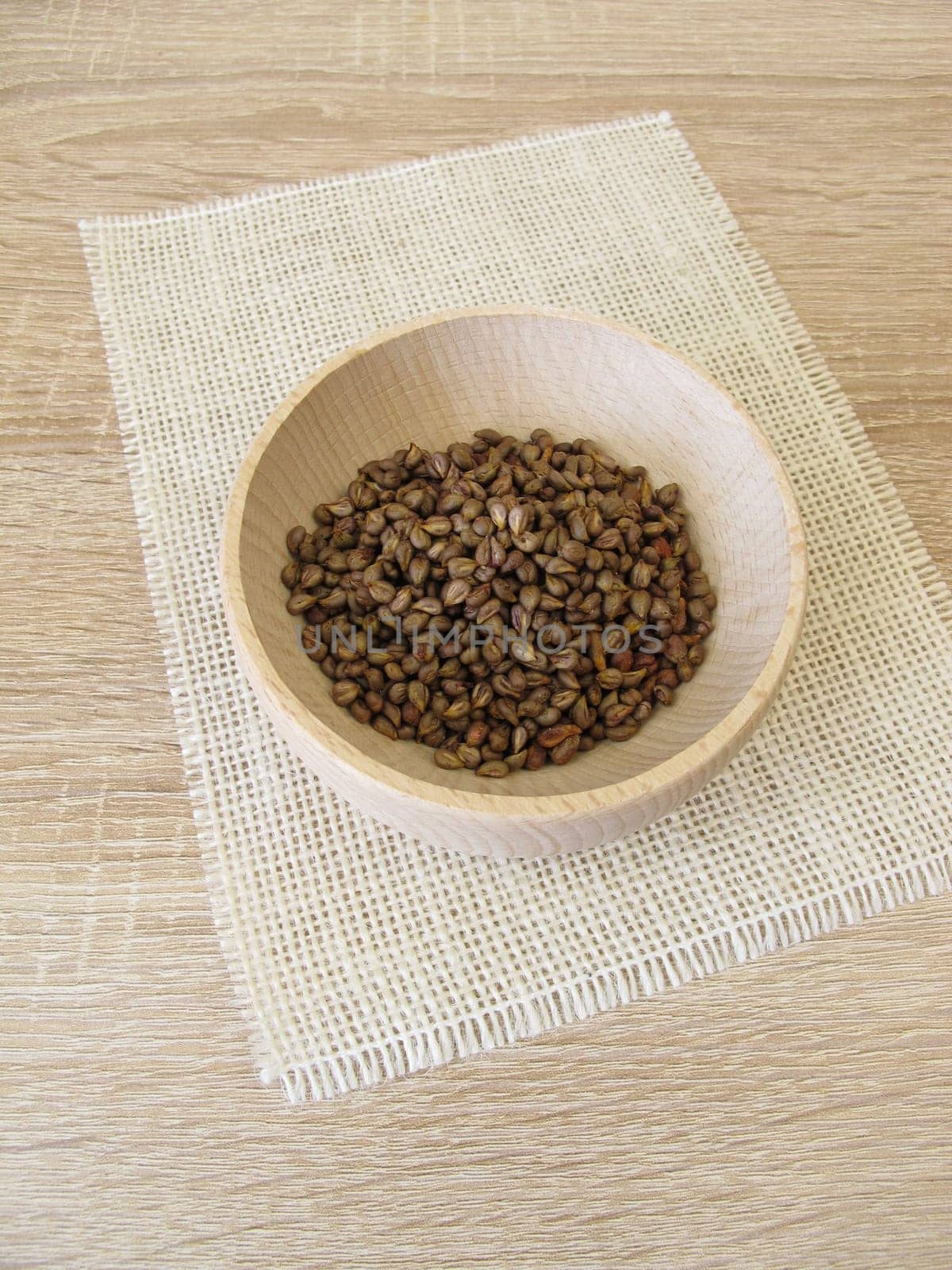 Grape seeds in a wooden bowl,Vitis viniferae semen